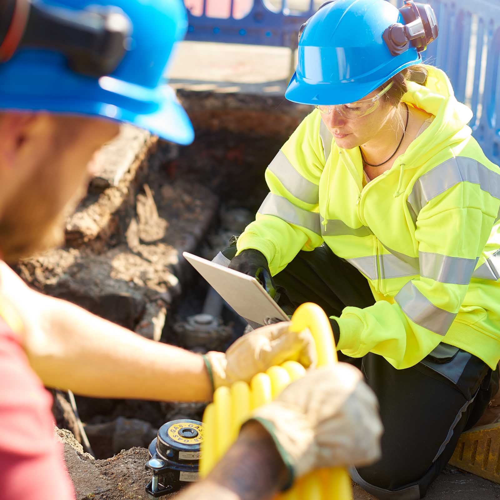 two-costruction-workers-working-together